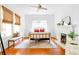 Sun-filled main bedroom with a fireplace and light hardwood floors at 291 Elmira Ne Pl, Atlanta, GA 30307