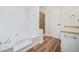 Bathroom featuring a soaking tub and separate shower at 5570 Deerfield Nw Pl, Kennesaw, GA 30144