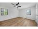 Bright bedroom features wood-look floors and neutral paint at 5570 Deerfield Nw Pl, Kennesaw, GA 30144