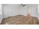Bright bedroom with laminate flooring, a view of the outdoors, closet, and a bathroom at 5570 Deerfield Nw Pl, Kennesaw, GA 30144
