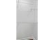 Closet features white metal shelves, new laminate floor and white walls at 5570 Deerfield Nw Pl, Kennesaw, GA 30144
