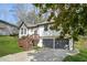Beautiful home with two-car garage, wood deck, a well maintained lawn, and mature trees at 5570 Deerfield Nw Pl, Kennesaw, GA 30144