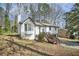 Charming home with a side entry garage, nice yard, and an inviting wooden deck at 5570 Deerfield Nw Pl, Kennesaw, GA 30144