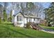 Charming home with a side entry garage, nice yard, and an inviting wooden deck at 5570 Deerfield Nw Pl, Kennesaw, GA 30144