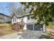 Exterior view of a two-story house, a driveway, and a two-car garage at 5570 Deerfield Nw Pl, Kennesaw, GA 30144