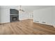 Spacious living room with stone fireplace and wood-look floors at 5570 Deerfield Nw Pl, Kennesaw, GA 30144