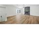 Bright living room featuring a stone fireplace and bay window at 5570 Deerfield Nw Pl, Kennesaw, GA 30144