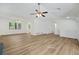 Open and airy living space with hardwood floors, modern lighting, and ample natural light at 5570 Deerfield Nw Pl, Kennesaw, GA 30144