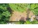 Aerial view of cleared land surrounded by lush trees, offering privacy and natural beauty at 715 Wood Valley Rd, Mableton, GA 30126