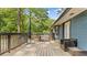 Spacious wooden deck with comfortable outdoor seating, ideal for enjoying the backyard view at 715 Wood Valley Rd, Mableton, GA 30126