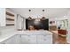 Modern kitchen features white cabinetry, quartz countertops, and stainless steel appliances at 715 Wood Valley Rd, Mableton, GA 30126