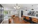 Open-concept living room and kitchen featuring modern finishes, stainless steel appliances, and hardwood floors at 715 Wood Valley Rd, Mableton, GA 30126