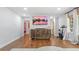 Cozy living area featuring hardwood floors, modern lighting, and neutral paint tones at 715 Wood Valley Rd, Mableton, GA 30126