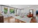 Bright living room with large windows, hardwood floors, a neutral color palette, and comfortable seating at 715 Wood Valley Rd, Mableton, GA 30126