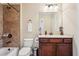 Well-appointed bathroom features custom cabinets, tub, and tiled shower at 2120 Cain Commons Dr, Dacula, GA 30019