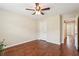 Spacious bedroom with hardwood flooring, a ceiling fan, and neutral paint at 2120 Cain Commons Dr, Dacula, GA 30019