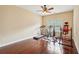 Well-lit exercise room with hardwood flooring and multiple workout machines at 2120 Cain Commons Dr, Dacula, GA 30019