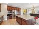 Beautiful kitchen with granite island, stainless steel appliances, and convenient breakfast bar seating at 2120 Cain Commons Dr, Dacula, GA 30019