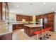 Beautiful kitchen featuring custom cabinets, stainless steel appliances, and granite countertops at 2120 Cain Commons Dr, Dacula, GA 30019