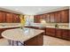 Gourmet kitchen features custom cabinets, granite counters, tile backsplash, and modern appliances at 2120 Cain Commons Dr, Dacula, GA 30019