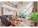 Open living area with soaring ceilings, upper level landing, and a stone fireplace create a grand space at 2120 Cain Commons Dr, Dacula, GA 30019