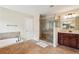 Spacious bathroom features a double vanity, soaking tub, and separate shower at 2120 Cain Commons Dr, Dacula, GA 30019