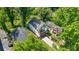 Bird's eye view of a modern home with deck and rooftop terrace in a lush, green neighborhood at 2186 Park Terrace, College Park, GA 30337