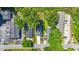Aerial view of a home in a quiet neighborhood showcasing mature trees, landscaping, and manicured lawn at 2186 Park Terrace, College Park, GA 30337