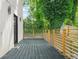 Spacious back deck with wooden railing overlooks a lush green lawn and beautiful backyard scenery at 2186 Park Terrace, College Park, GA 30337