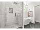 Bathroom features a modern shower with glass enclosure and a freestanding tub at 2186 Park Terrace, College Park, GA 30337