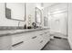 Modern bathroom with dual sinks, granite counters, and a shower-tub combination at 2186 Park Terrace, College Park, GA 30337