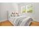 Bright bedroom featuring a comfortable bed, natural light, and hardwood floors at 2186 Park Terrace, College Park, GA 30337