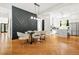 Open dining room area with modern table, chairs, and stylish light fixture at 2186 Park Terrace, College Park, GA 30337