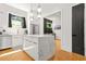 Bright kitchen with a modern island, pendant lights, and stainless steel appliances at 2186 Park Terrace, College Park, GA 30337