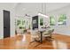 Living room with ample natural light, modern fireplace, and hardwood floors at 2186 Park Terrace, College Park, GA 30337