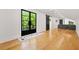 Modern living room featuring large windows, hardwood floors and an area rug at 2186 Park Terrace, College Park, GA 30337