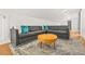 Modern living room boasts stylish sofa, round table and hardwood flooring at 2186 Park Terrace, College Park, GA 30337
