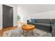 Modern living room with sleek gray sofa, area rug and a view from window at 2186 Park Terrace, College Park, GA 30337