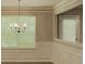 Elegant dining area featuring wainscoting, modern light fixture, and large windows at 2429 Wood Bend Ln, Riverdale, GA 30296