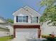 Charming two-story home featuring brick accents and a well-maintained front yard at 2429 Wood Bend Ln, Riverdale, GA 30296