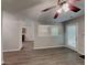 An open-concept living room boasts modern flooring, fireplace, and abundant natural light at 2429 Wood Bend Ln, Riverdale, GA 30296