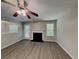 Inviting living room with a cozy fireplace, ceiling fan, and neutral tones at 2429 Wood Bend Ln, Riverdale, GA 30296