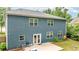Back of home features blue siding, white trim windows, walk out patio, with a fenced yard at 3016 Levinshire Way, Dacula, GA 30019