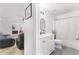 Modern bathroom featuring a white vanity, a mirror, and a shower with a decorative curtain at 3016 Levinshire Way, Dacula, GA 30019
