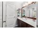 Clean bathroom with a single vanity, a large mirror, and a shower with a stylish shower curtain at 3016 Levinshire Way, Dacula, GA 30019