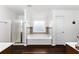 Bright bathroom featuring a separate shower and tub, complemented by modern fixtures and neutral tones at 3016 Levinshire Way, Dacula, GA 30019