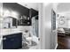 Bathroom featuring a modern vanity and a shower-tub combo with stylish fixtures at 3016 Levinshire Way, Dacula, GA 30019