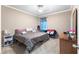Cozy bedroom with neutral colors, carpet, and a large window at 3016 Levinshire Way, Dacula, GA 30019