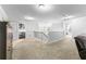 Spacious hallway with carpet flooring, white walls and trim, and views of an adjacent bathroom at 3016 Levinshire Way, Dacula, GA 30019