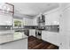 Updated kitchen with stainless steel appliances, white cabinets, and granite countertops at 3016 Levinshire Way, Dacula, GA 30019